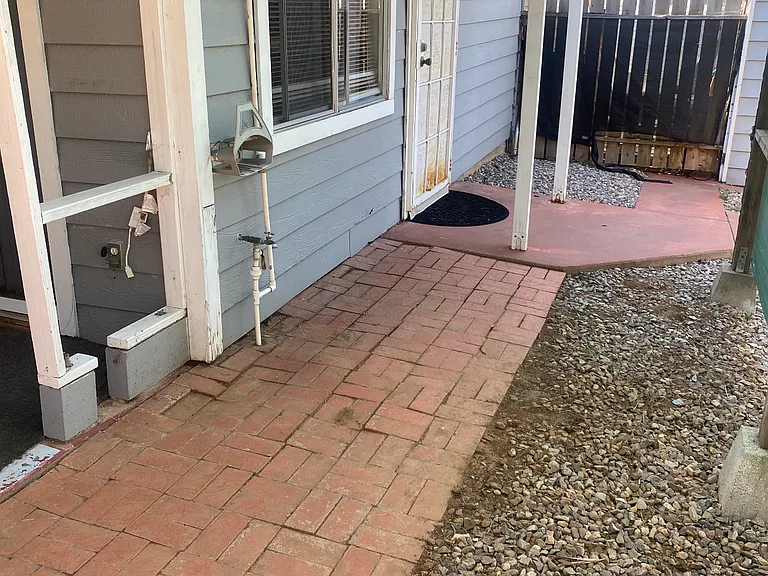 Front door area and private yard space.