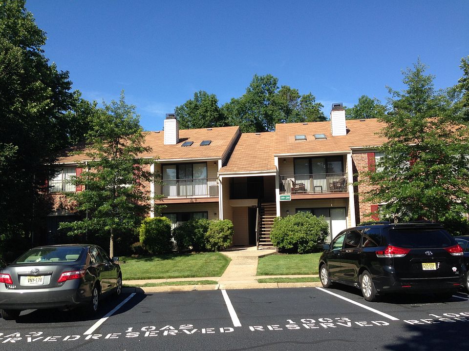 This 3-story building has 3 floors on the rear side and 2 fl