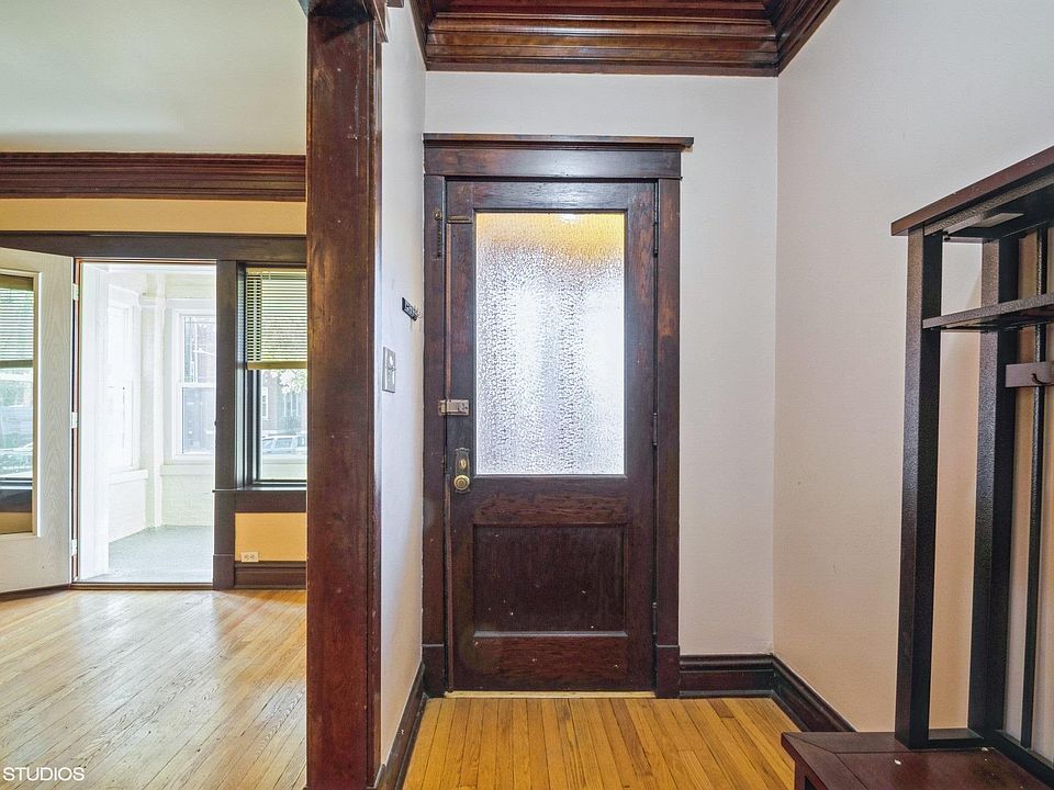 Enter into a sun filled unit with gorgeous millwork and a built-in bench.