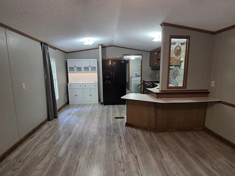 Living room looking into the dining area and kitchen