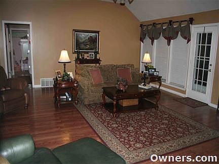 Large open family room with wood floors