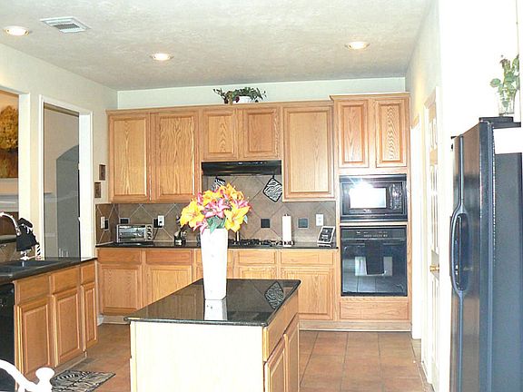 ADDITIONAL VIEW OF KITCHEN LOOKING FROM BREAKFAST