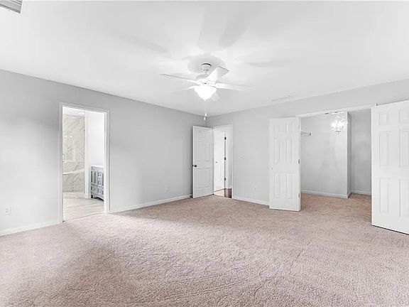 Master bedroom;
bathroom door (left), hallway entrance (middle), double doors for walk-in closet (right)