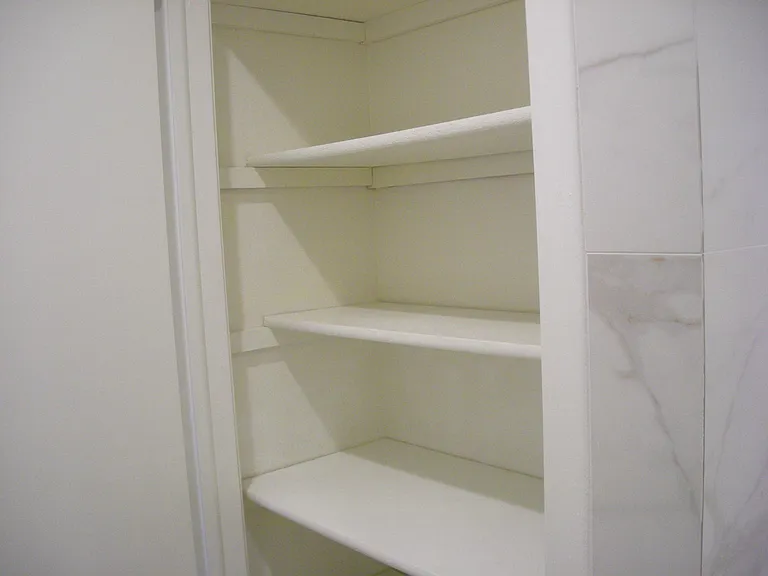 Linen Closet in Second Bathroom with Tub