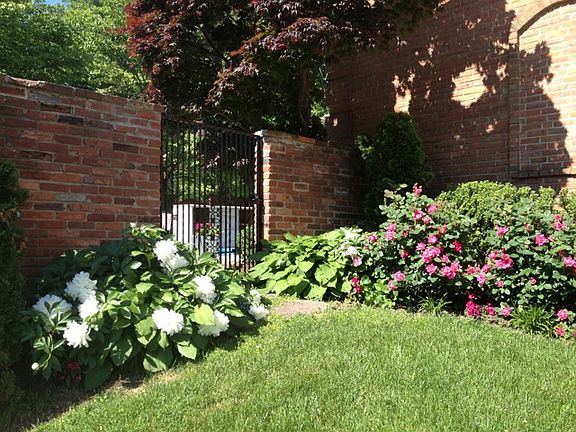Wrought iron gate to patio