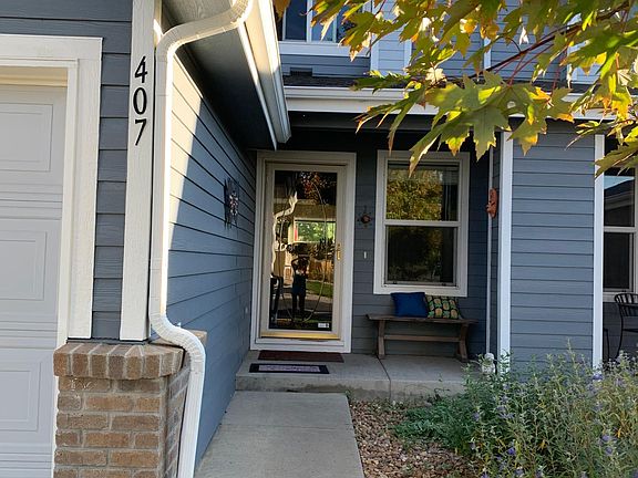 front door and window of townhouse