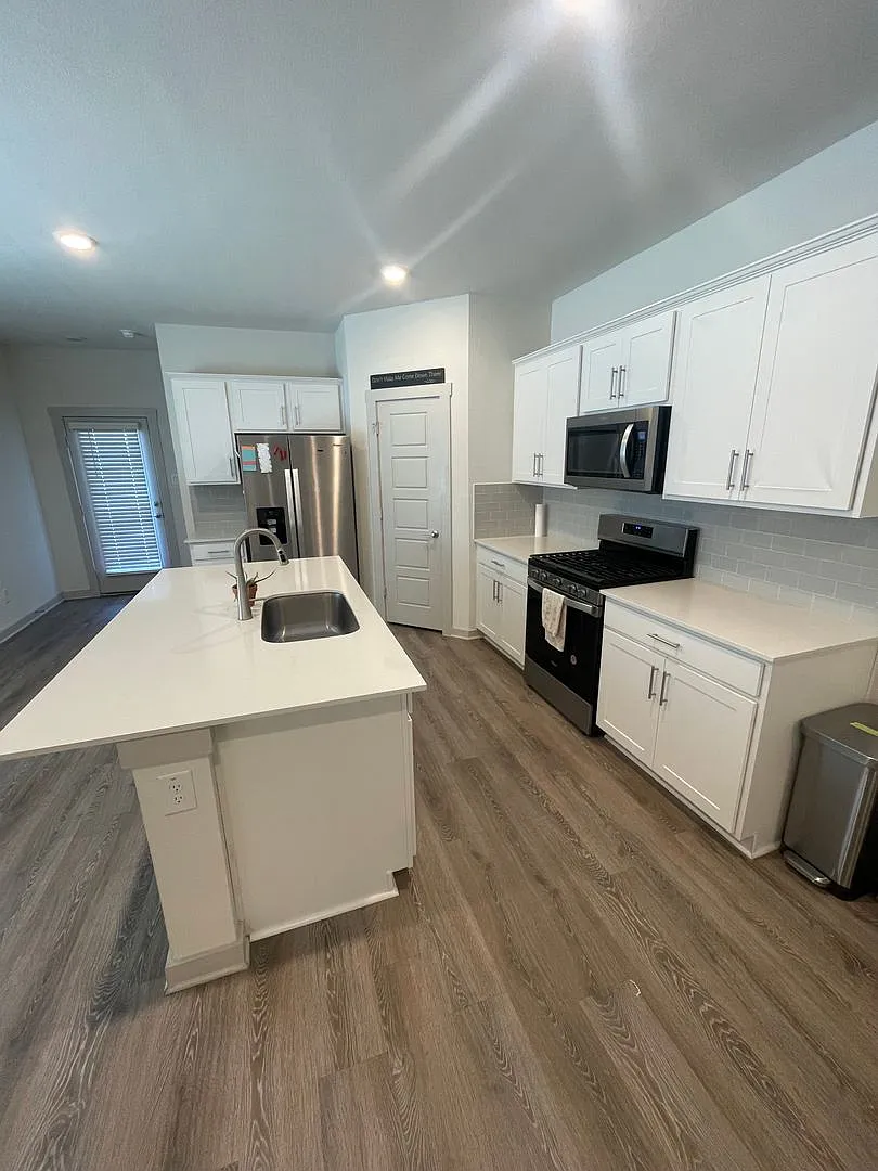 3 bed 2 bath home with attached garage and fenced in backyard built in 2023 — Photo 2