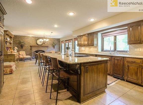Massive granite island and built in fridge greet you in the kitchen!