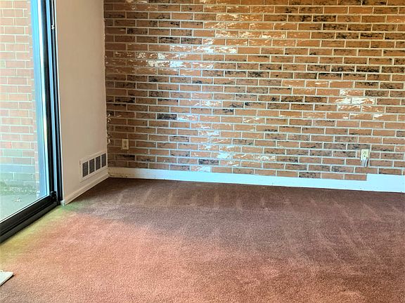 Dining room w/ brick accent