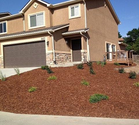 Front yard. Yes, it's an end unit with a small deck.