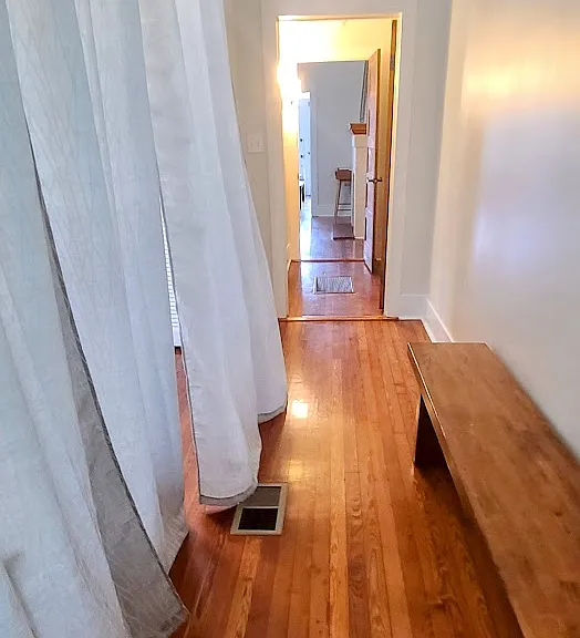 Moveable curtain in Queen Bedroom creates visual privacy.