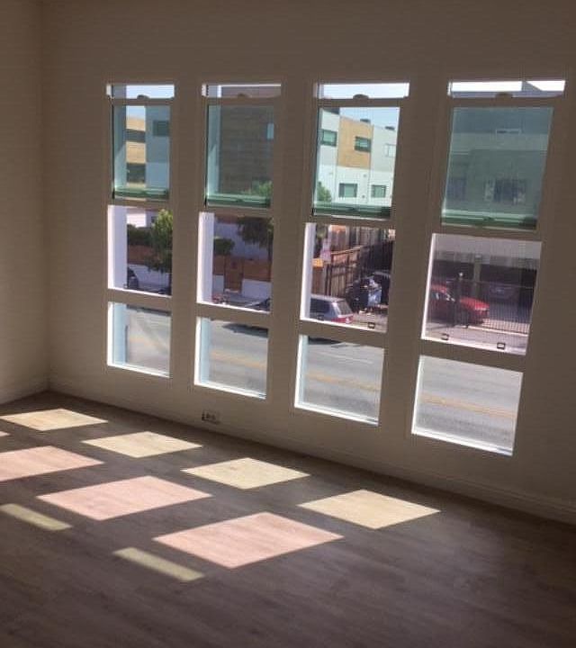 Newly installed livingroom windows with vertical blinds (2nd floor)