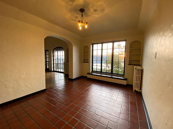 Large dining room with living room and breakfast nook entries.