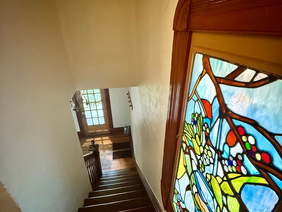Stained glass window. Stairs looking down from unit