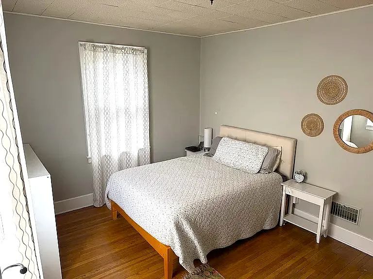 Bedroom two with two windows and closet