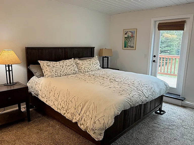 Primary bedroom + walk out porch