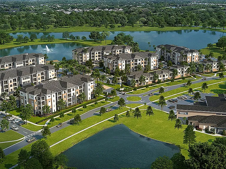 Integra Avalon, an inviting apartment community with modern architecture, lush landscaping, and serene palm-lined pathways, perfect for comfortable living.