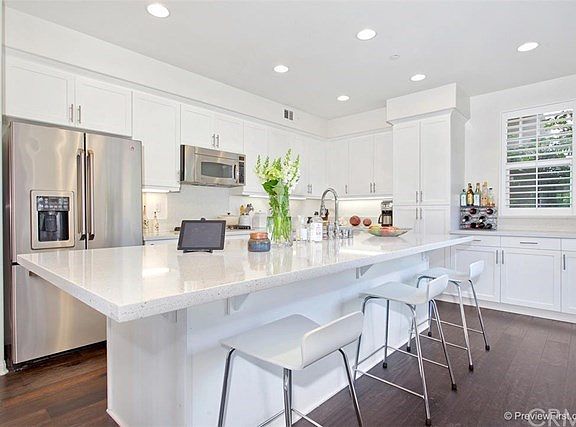 Custom kitchen with Caeasarstone counters and high-end finishes