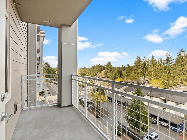 Step out onto your private balcony and soak in serene views of vibrant greenery and clear blue skies_your perfect spot for morning coffee or sunset unwinding. Step out onto your private balcony and soak in serene views of vibrant greenery and clear blue s