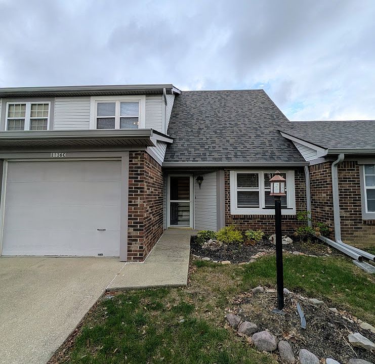 Main entrance with single car attached garage.