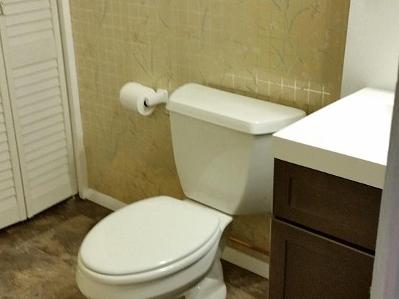 downstairs powder room with large closet