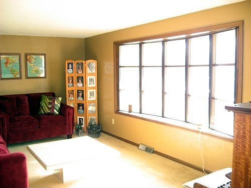 Living Room is Well Lighted -- Lots of Windows