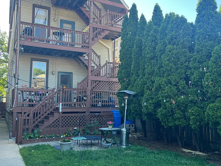 Back yard - grass, brick patio, garden space for growing veggies and flowers, and our "forest" - a row of evergreen trees that are beautiful in all seasons.