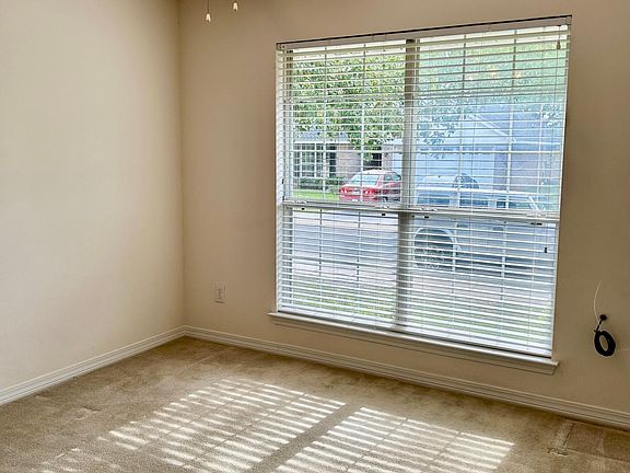 First Bedroom with closet and plenty of light. This room would also be great for an office.