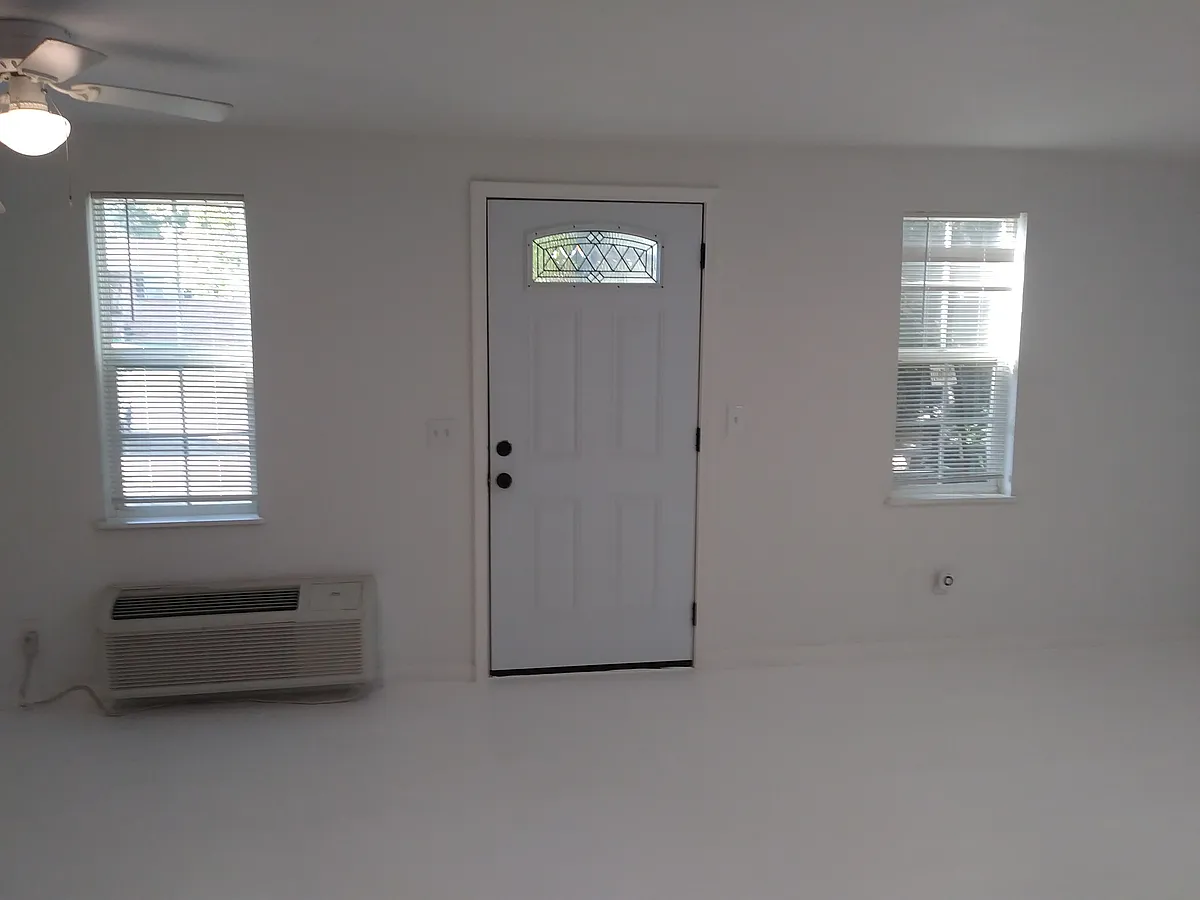 In-side front entrance with in wall A/C heat and cool. - 2100 Plum Ln