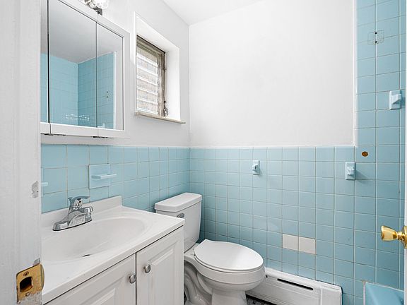 Bright bathroom with shower & tub.