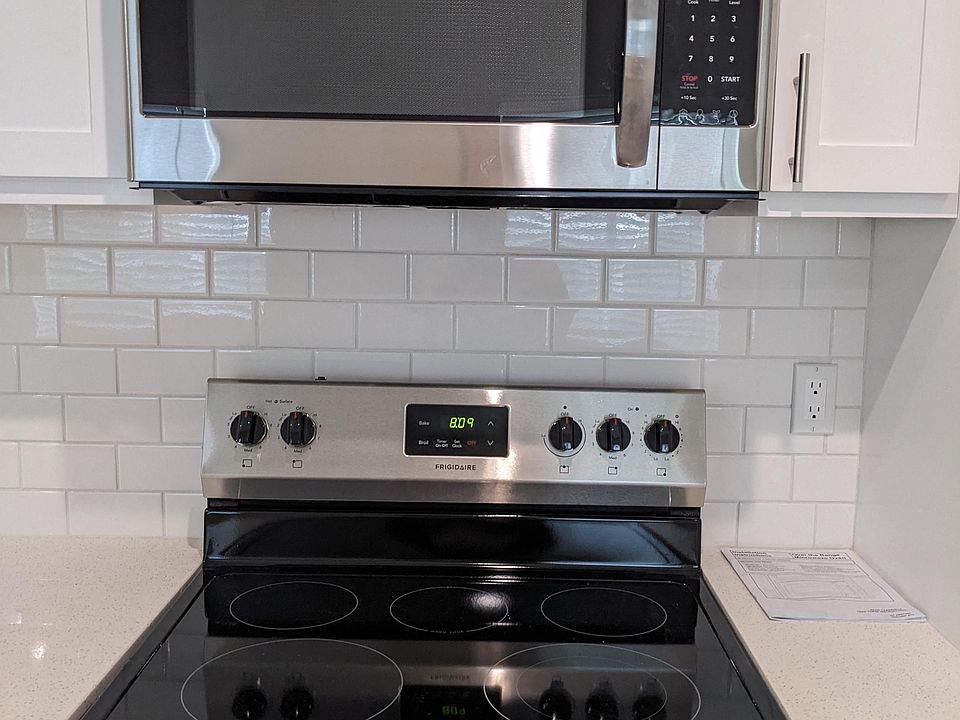 Upscale electric range and micorwave at The Hardison Apartments in Pasadena, California.