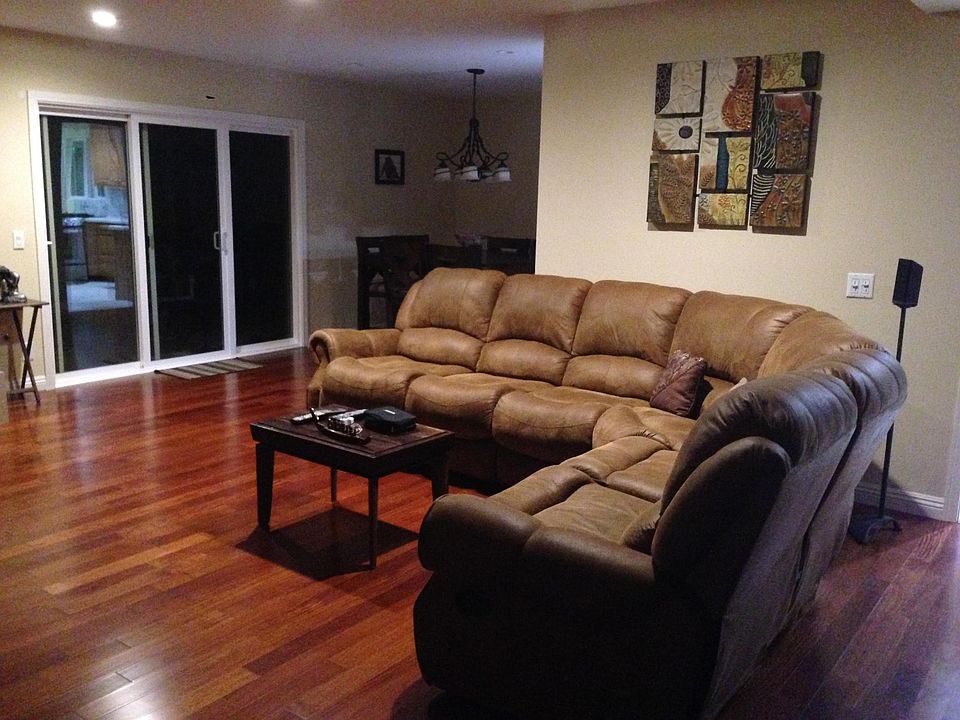 Upgraded Living Room with Santos Mahogany Hardwood Floors and Recessed LED Lighting