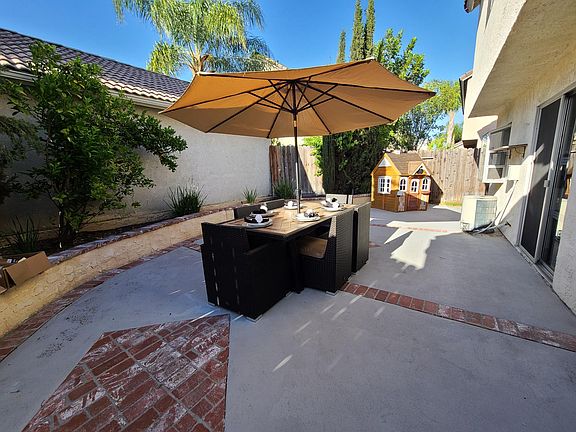 Imagine yourself with a glass in your hand, laughter and great conversation around this very large table in a very large private back patio.