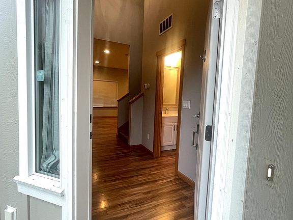Welcome to your new rental. Upon entry, there is a laundry room, half bathroom and jacket closet.