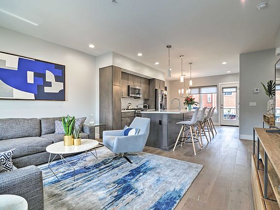 Inside on the 1st floor is an incredibly warm and inviting open floor plan.
