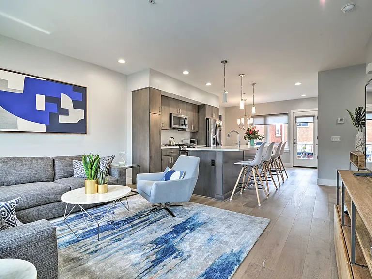 Inside on the 1st floor is an incredibly warm and inviting open floor plan.