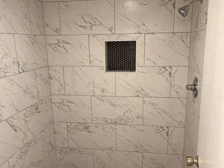 Primary bathroom all stone shower.
