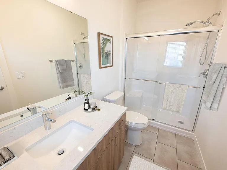 Quartz countertops and step-in showers