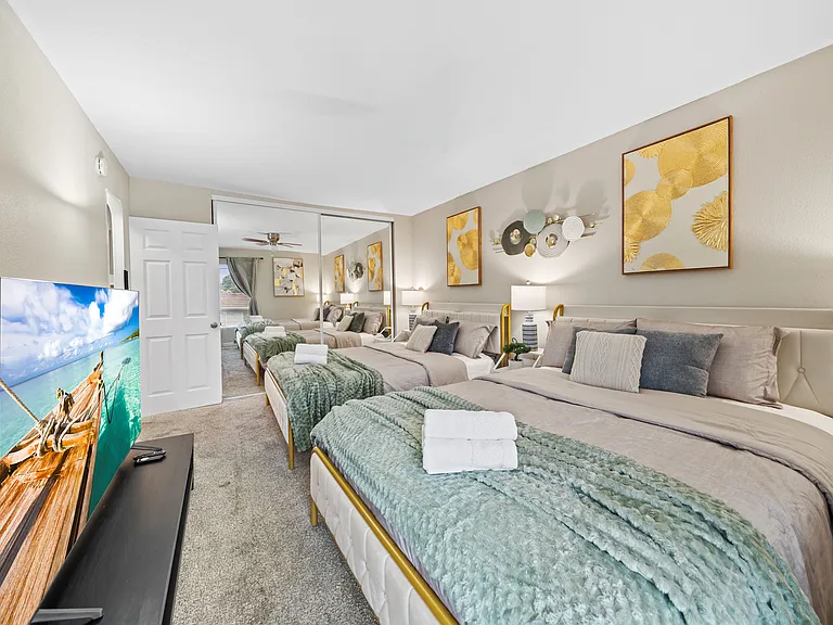 Comfortable bedroom featuring two queen beds, perfect for families or groups.