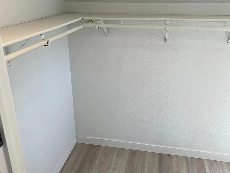 Huge walk in closet with natural light off of primary bathroom