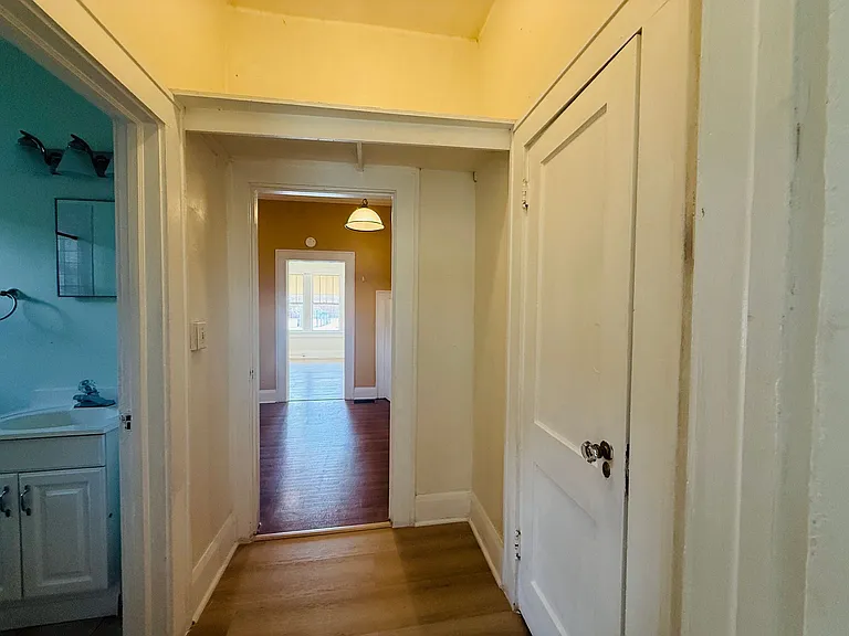 looking towards kitchen and living room from the bedroom