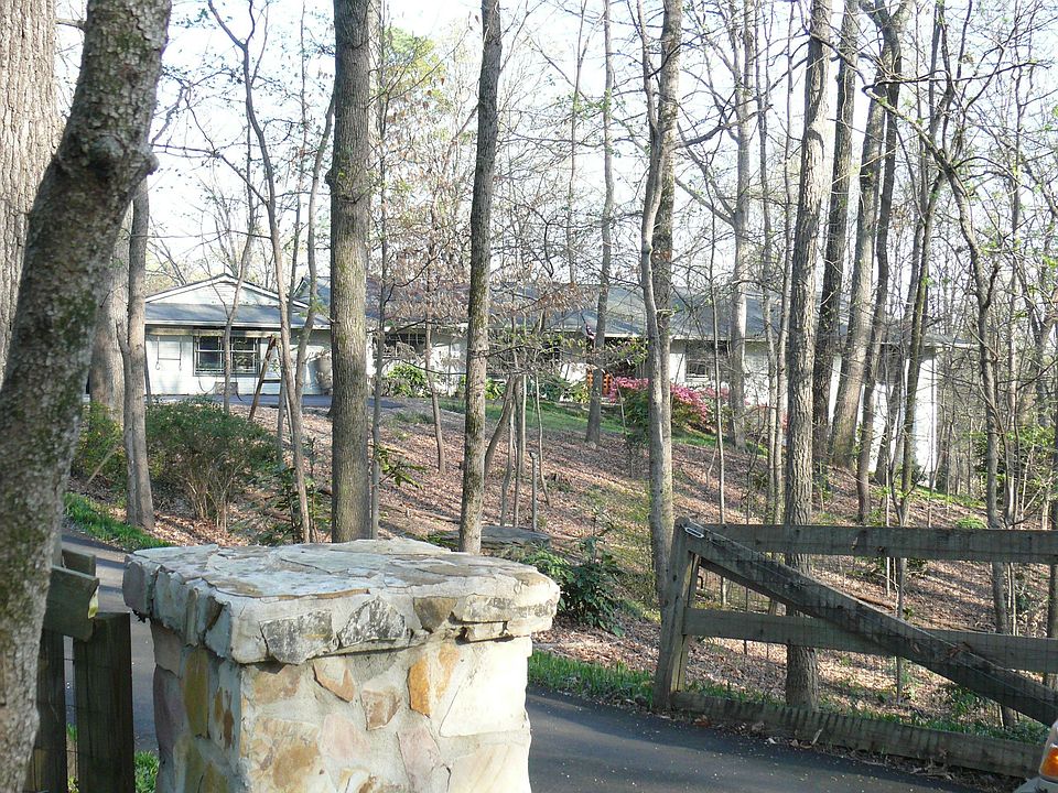 Set far back from the road with a gate for added privacy