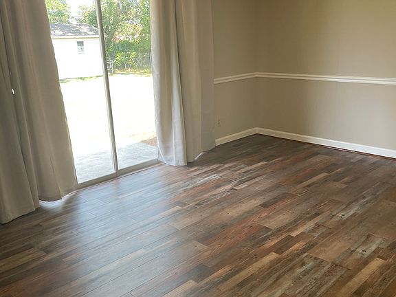 Den with sliding glass door