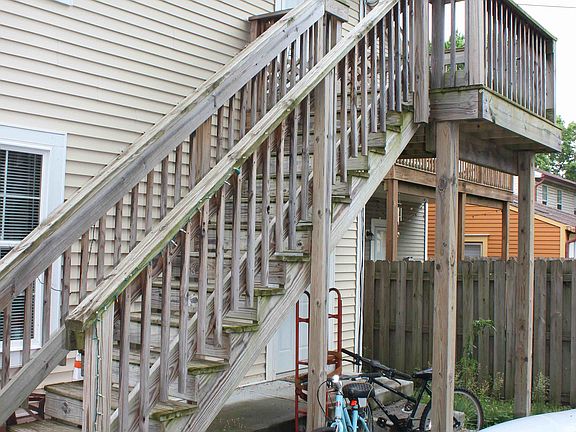 Unit is second floor only; these stairs are used to access the east side entrance.