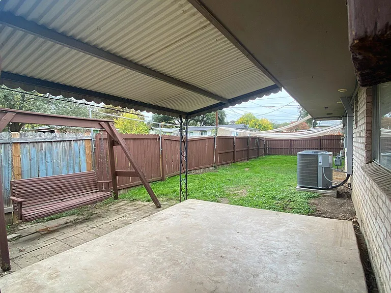 Private backyard view from gated entrance