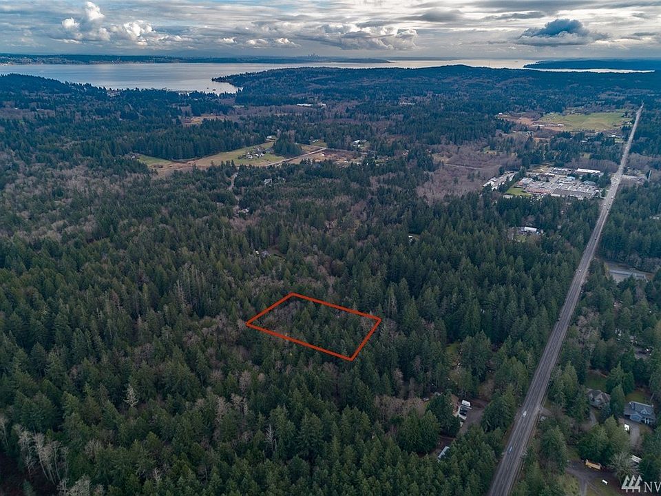 This treed and private almost 5 acres is very close to the Albertson's Grocery Store.  And 3.3 miles to the Kingston Ferry. 