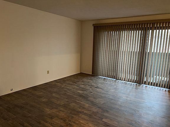 Livingroom with slider to screened in deck