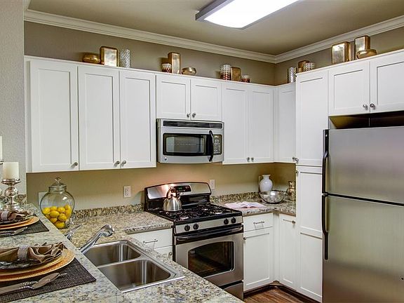 Antique white cabinets make your kitchen airy and light
