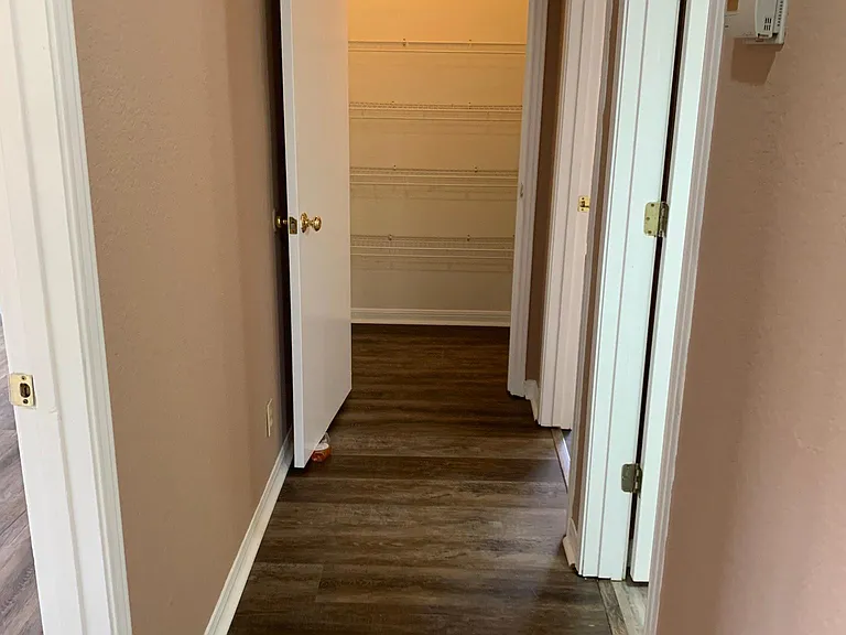 Hall way with linen closet at end