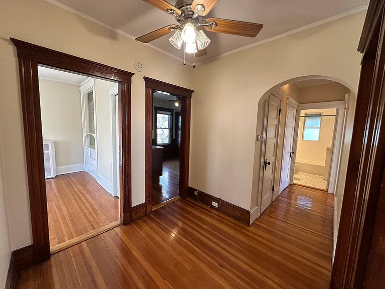 Entryway with view down hallway, into dining room and kitchen